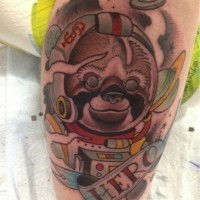 Amazing painted and colored little spaceman sloth with lettering tattoo on arm