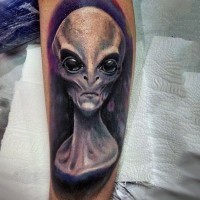 Amazing painted and colored very detailed alien portrait tattoo on arm