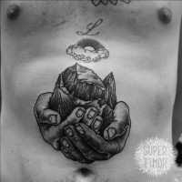 Amazing painted black ink mountain in hands tattoo on belly