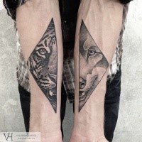 Amazing painted by Valentin Hirsch tattoo of split animal portraits on forearms