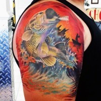 Amazing painted colorful big detailed hooked fish tattoo on arm top
