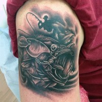 Amazing painted detailed black and white hooked fish tattoo on shoulder