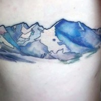Amazing painted glorious mountains colored tattoo on side