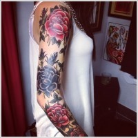 Amazing painted half colored floral tattoo on sleeve