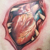 Amazing ripped heart tattoo on chest
