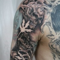 Amazing skeleton face tatto on boys shoulder