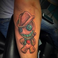 Amazing tiny colored forearm tattoo of cowboy voodoo doll