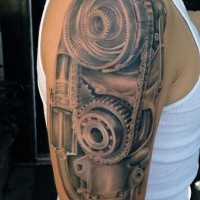 Amazing very detailed black and white old mechanism tattoo on upper arm