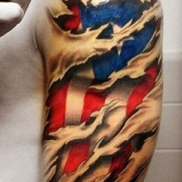 American flag under skin rip tattoo on shoulder