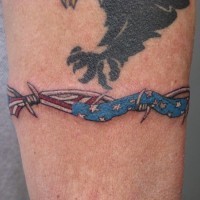 American flag with barbed wire tattoo