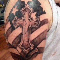 American native colored antic cross tattoo on shoulder with old flag