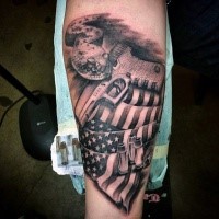 American native colored forearm tattoo of national flag with pistol and snake