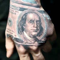 American native realistic looking 100 bill tattoo on hand