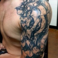 American native very realistic black and white national flag tattoo on sleeve