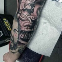 Ancient style colored forearm tattoo of warrior statue combined with Spartan king portrait