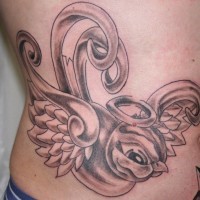 Angel swallow tattoo on ribs