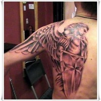 Angel warrior with a shield and sword tattoo on shoulder blade