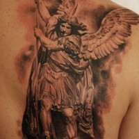Angel with spear tattoo on shoulder blade