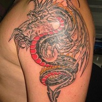 Angry dragon tattoo on arm