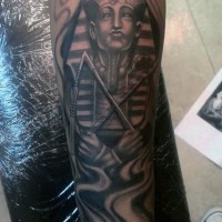 Antic Egypt themed black ink forearm tattoo of Pharaoh statue