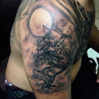 Antic style colored Sagittarius tattoo on shoulder with moon