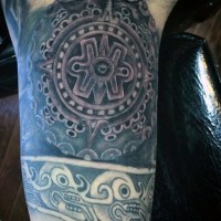 Antic tribes detailed tablet tattoo on arm