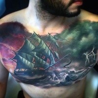 Art style colored chest tattoo of sailing ship in stormy sea