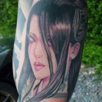 Asian cartoon like cute geisha portrait tattoo on arm muscle