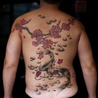 Asian native colored carp fishes tattoo on whole back with blooming tree