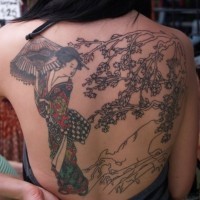 Asian native half colored whole back tattoo of nice looking geisha with blooming tree
