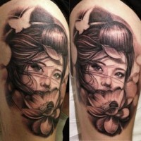 Asian style big black and white realistic woman with flowers tattoo on shoulder