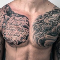 Asian style black and white dragon with lettering tattoo on chest