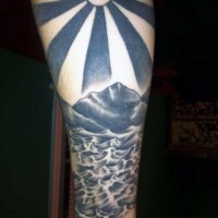 Asian style black and white sun with ocean tattoo on arm