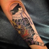 Asian style colored forearm forearm tattoo of Manmon cat stylized by demonic mask