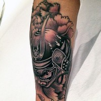 Asian style colored forearm tattoo of samurai helmet in fog