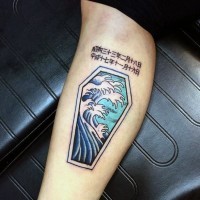 Asian style colored little coffin with lettering tattoo on arm