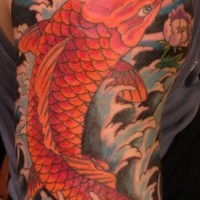 Asian style colorful shoulder tattoo of carp fish flowers and waves