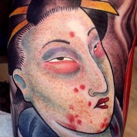 Asian style designed and colored biceps tattoo of bloody geisha portrait