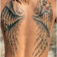 Asian style little black and white wings with symbol tattoo on whole back