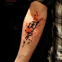 Asian style multicolored abstract tattoo on forearm combined with lettering