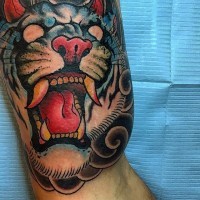 Asian style multicolored evil demonic tiger tattoo on biceps