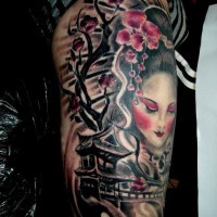 Asian style multicolored shoulder tattoo of geisha woman with antic bridge and blooming tree
