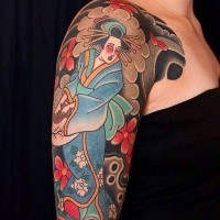 Asian style painted and colored shoulder tattoo of dancing geisha with flowers