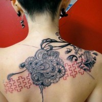 Asian style painted little black and white flowers with puzzle tattoo on upper back