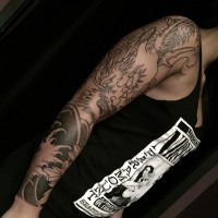 Asian style unfinished black ink sleeve tattoo of big dragon