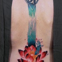 Asian themed big colored flower tattoo on back with big black ink road sign