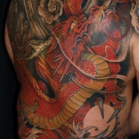 Asian traditional big colored whole back tattoo of detailed dragon