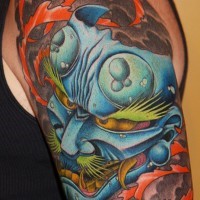 Asian traditional colored big shoulder tattoo of Asian demonic mask