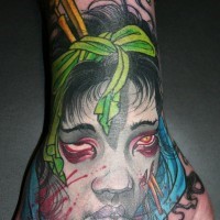 Asian traditional colorful hand tattoo of Asian zombie woman head