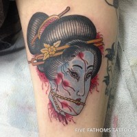 Asian traditional like colored severed woman`s head tattoo